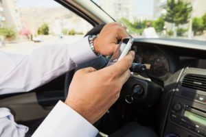 Man texting while driving