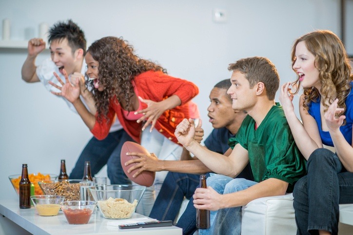 People sitting watching the Super Bowl